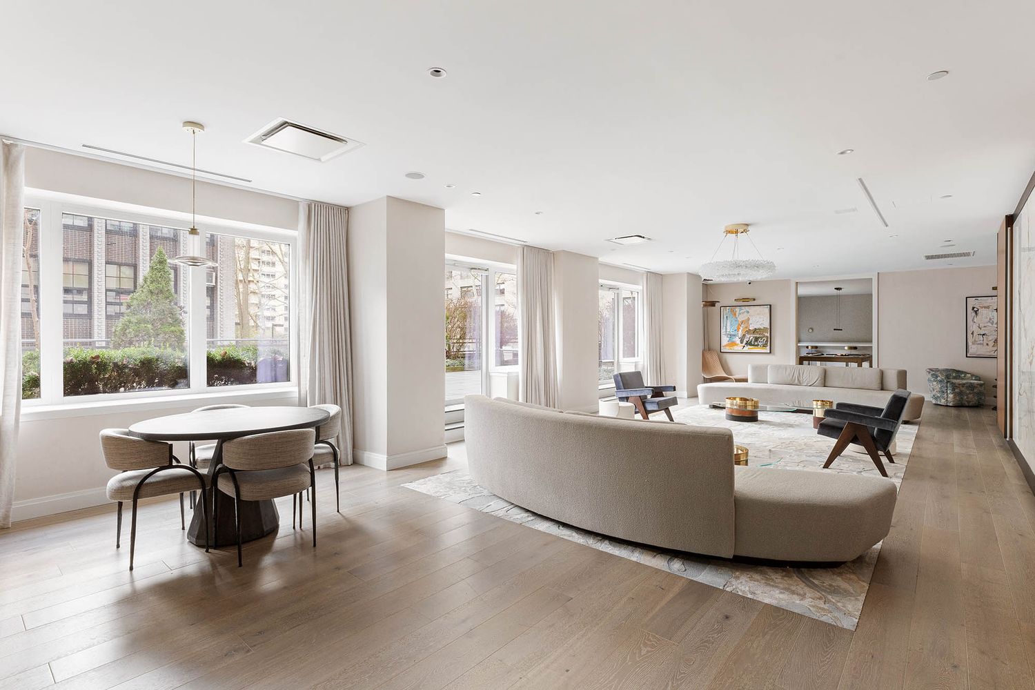 200 West End Avenue, Unit PHA Manhattan, NY 10023 - Photo 18 of 30 a living room with furniture a table and large windows