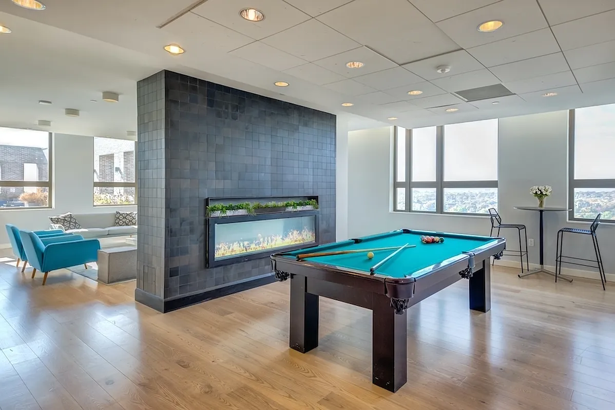 626 Flatbush Avenue, Unit 12D Brooklyn, NY 11225 - Photo 8 of 18 a living room with furniture and a fireplace