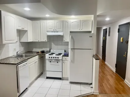 a kitchen with stainless steel appliances granite countertop white refrigerator stove a sink and dishwasher