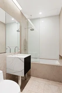 a bathroom with a bathtub and a sink