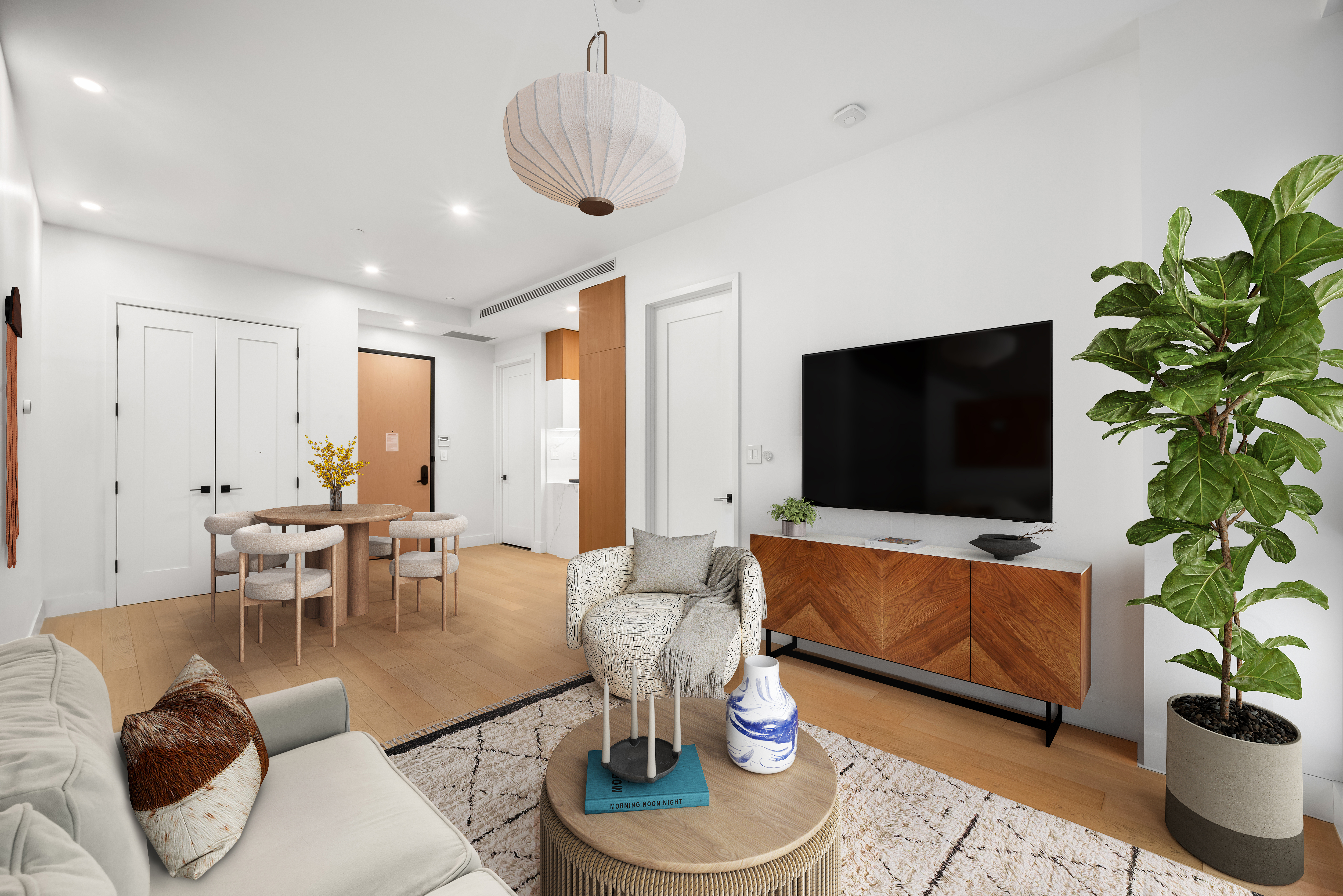 4507 Court Square, Unit 6A Queens, NY 11101 - Photo 2 of 19 a living room with furniture potted plant and a large window