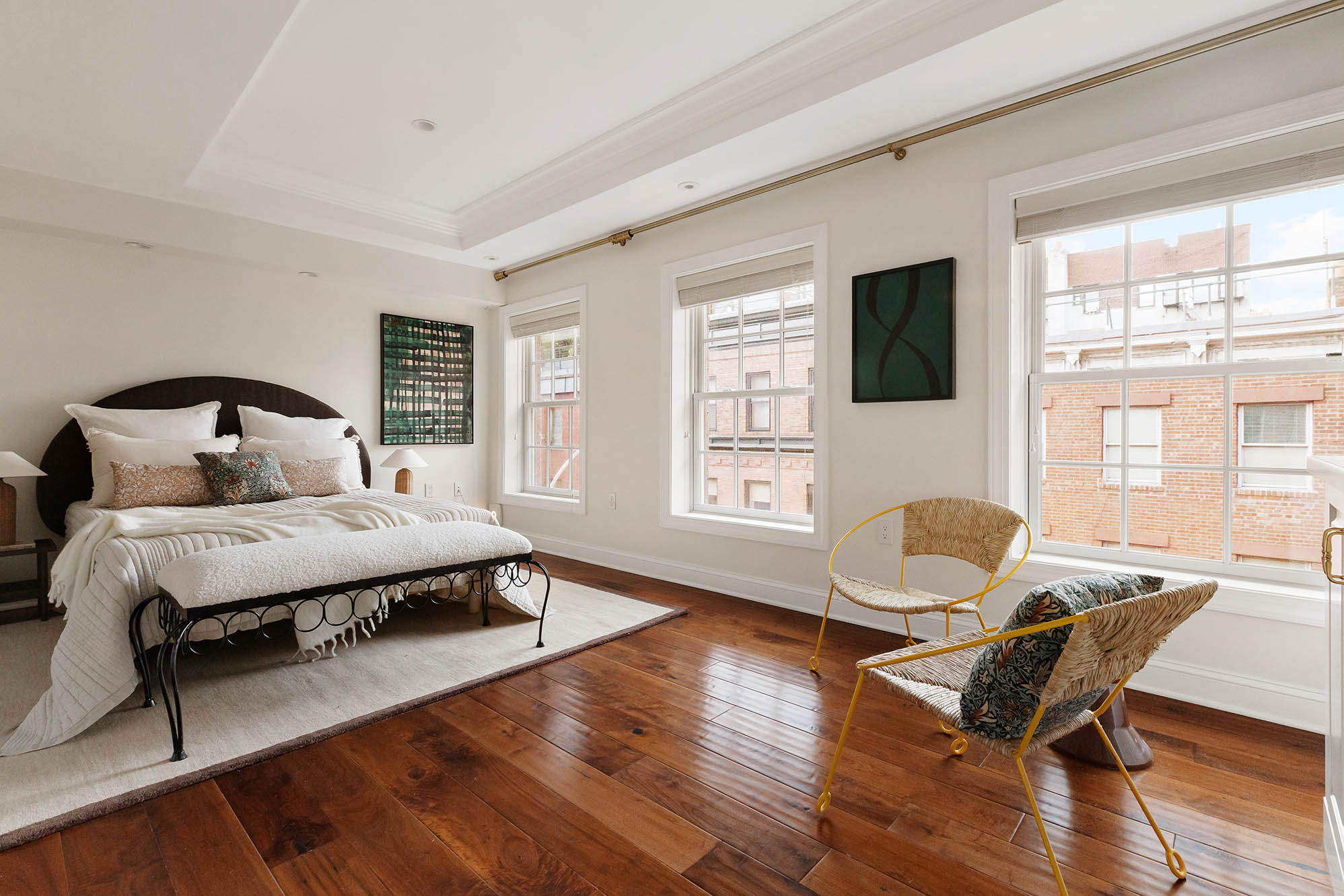 12 Leroy Street Manhattan, NY 10014 - Photo 9 of 20 a bedroom with a bed a large window and a flat screen tv
