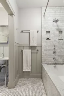 a bathroom with a bathtub and shower