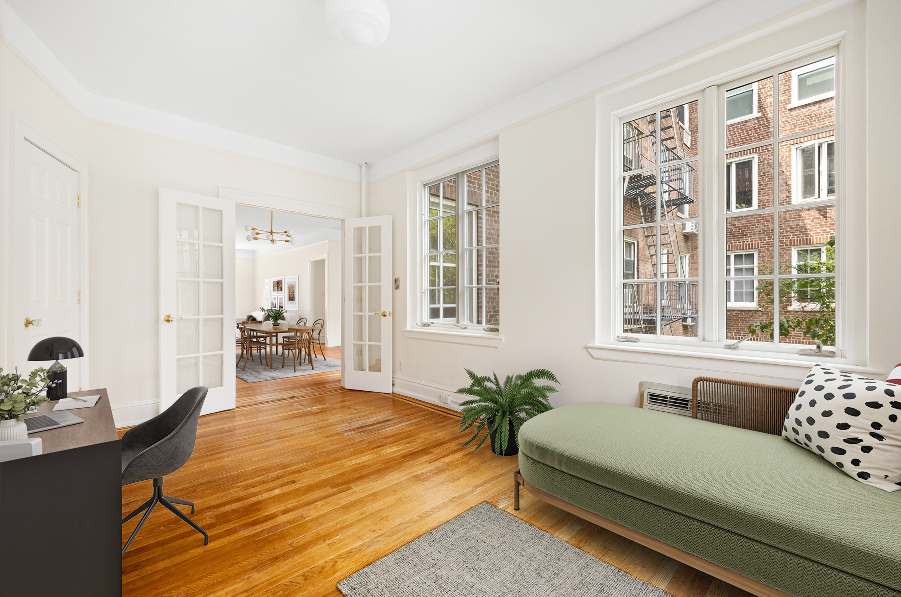 35-27 76th Street, Unit 21 Queens, NY 11372 - Photo 9 of 24 a spacious bedroom with a bed window and table