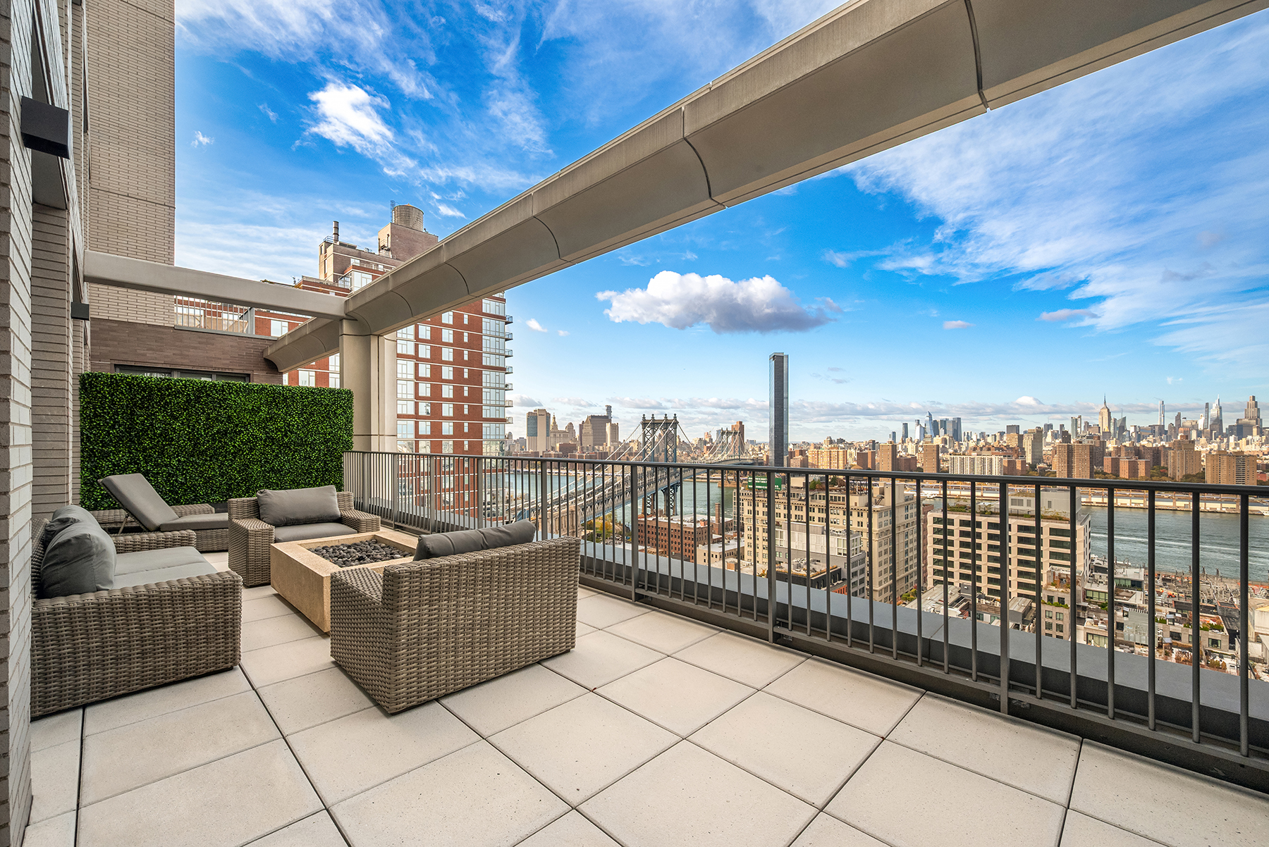 a view of a terrace with couches and pool