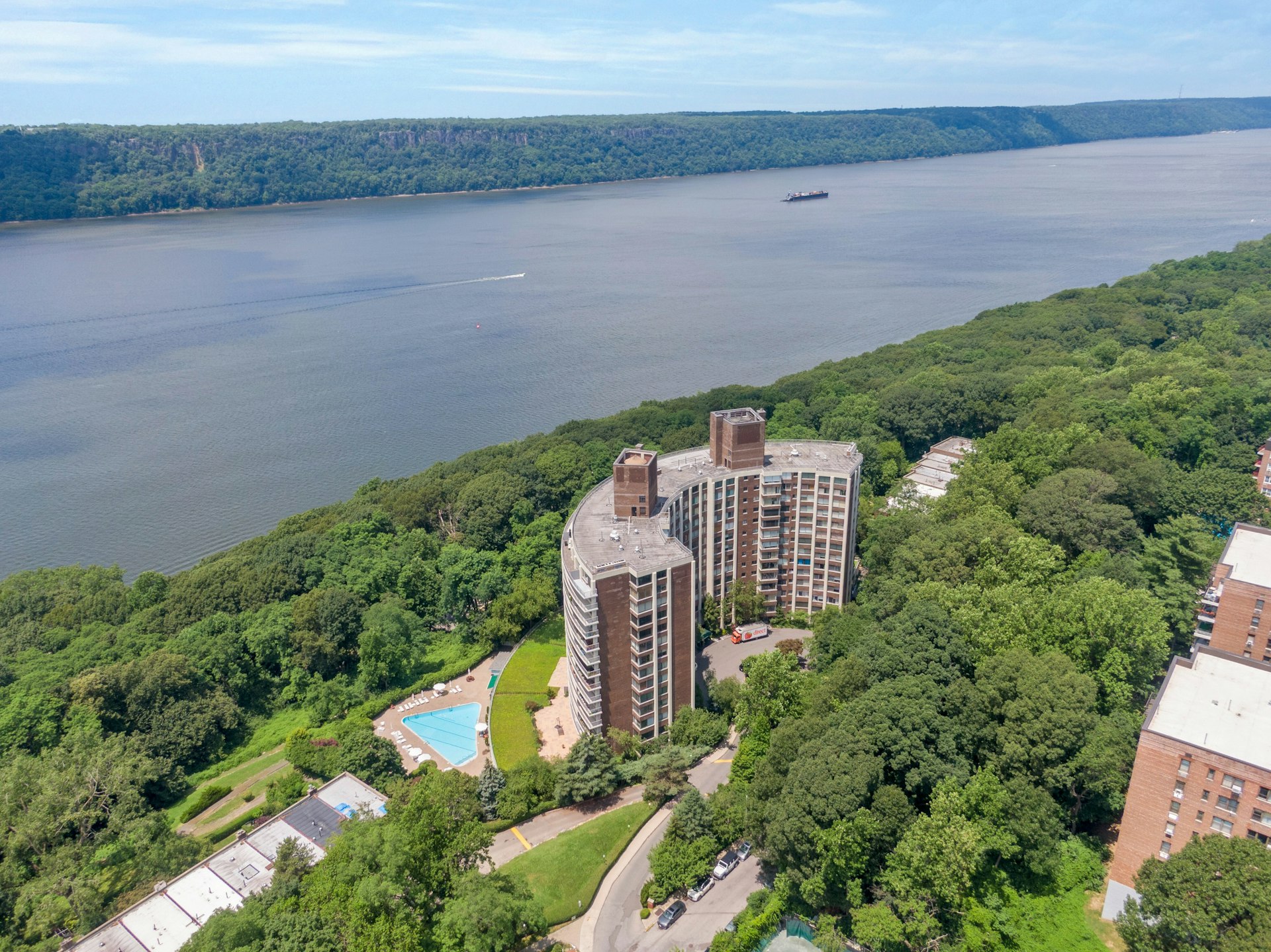 4455 Douglas Avenue, Unit 3FE Bronx, NY 10471 - Photo 52 of 53 a view of a garden with a building in the background