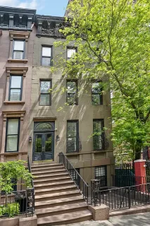 a view of a building with a tree