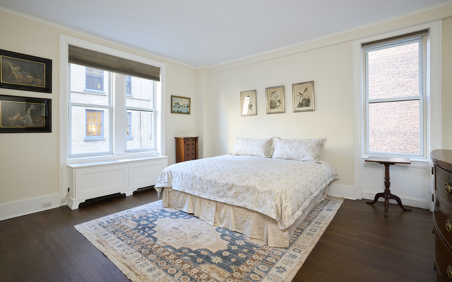 161 East 79th Street, Unit 7B Manhattan, NY 10075 - Photo 9 of 15 a bedroom with a bed lamps and a window