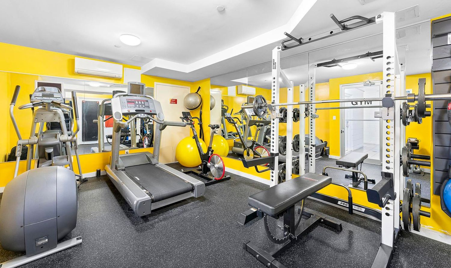 51 East 128th Street, Unit 1C Manhattan, NY 10035 - Photo 8 of 9 a view of a room with gym equipment
