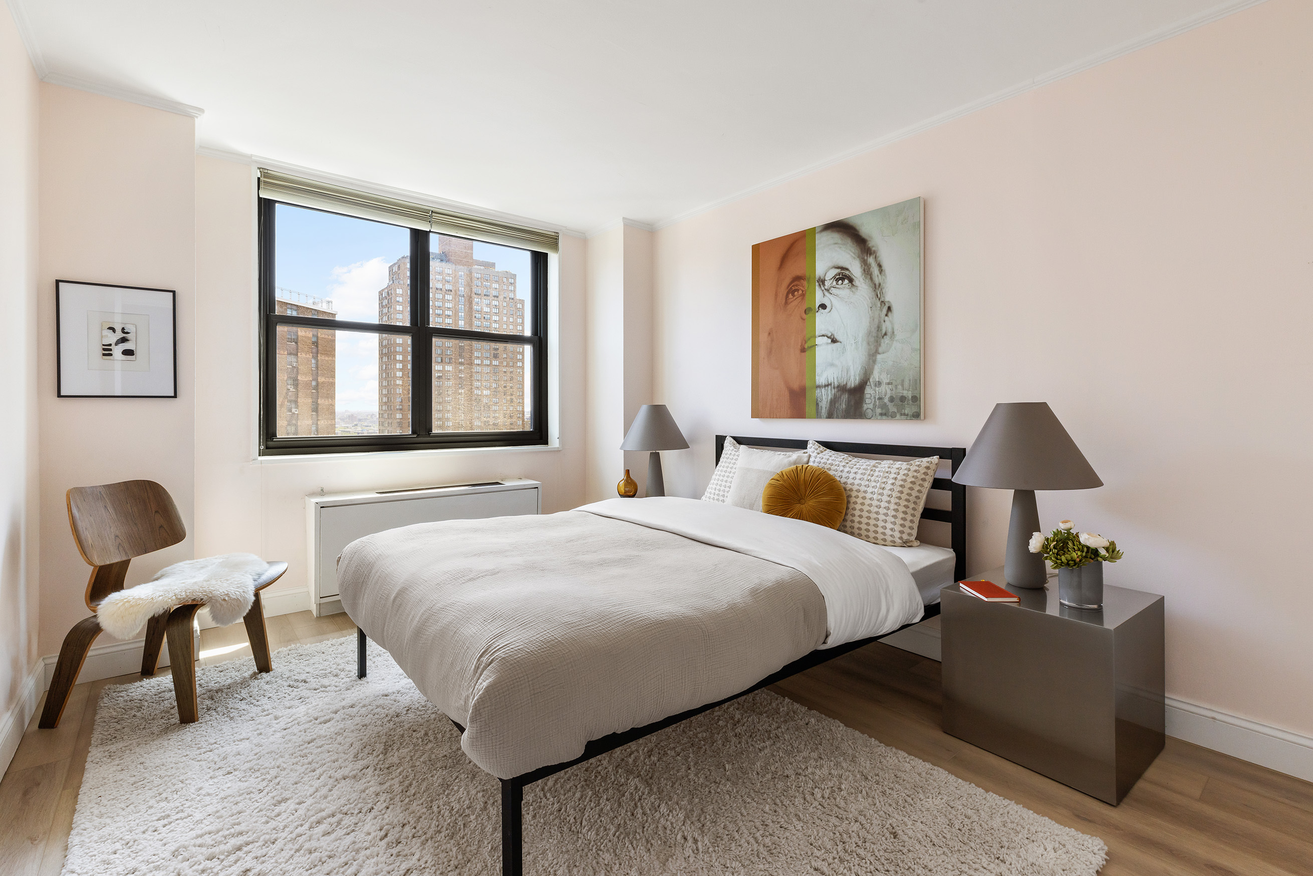 340 East 93rd Street, Unit 21F Manhattan, NY 10128 - Photo 4 of 6 a bedroom with bed and window