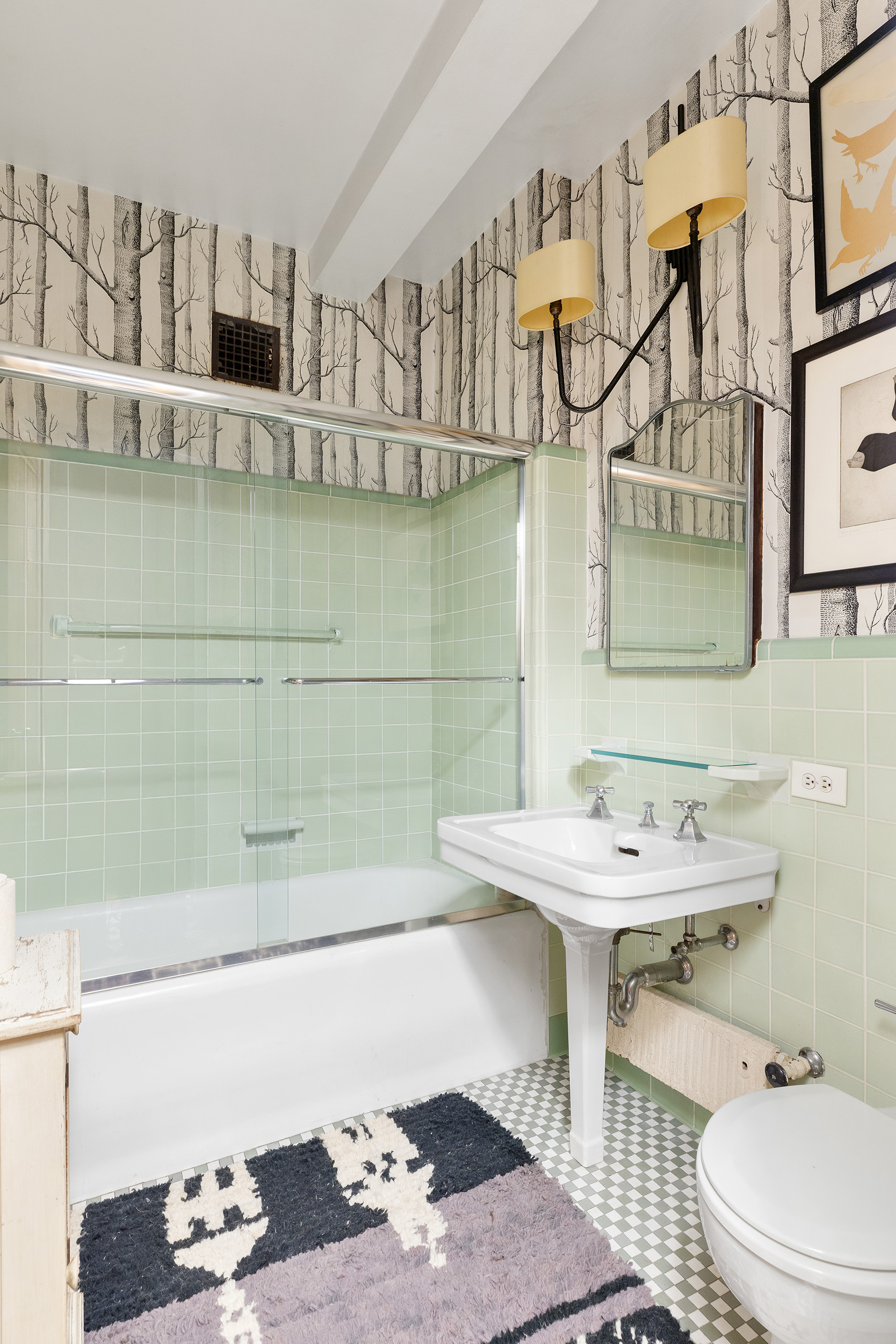 25 Central Park West, Unit 11C Manhattan, NY 10023 - Photo 10 of 17 a bathroom with a sink and a mirror
