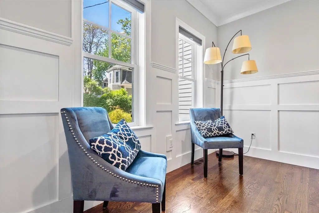 a wooden bench sitting in front of a house