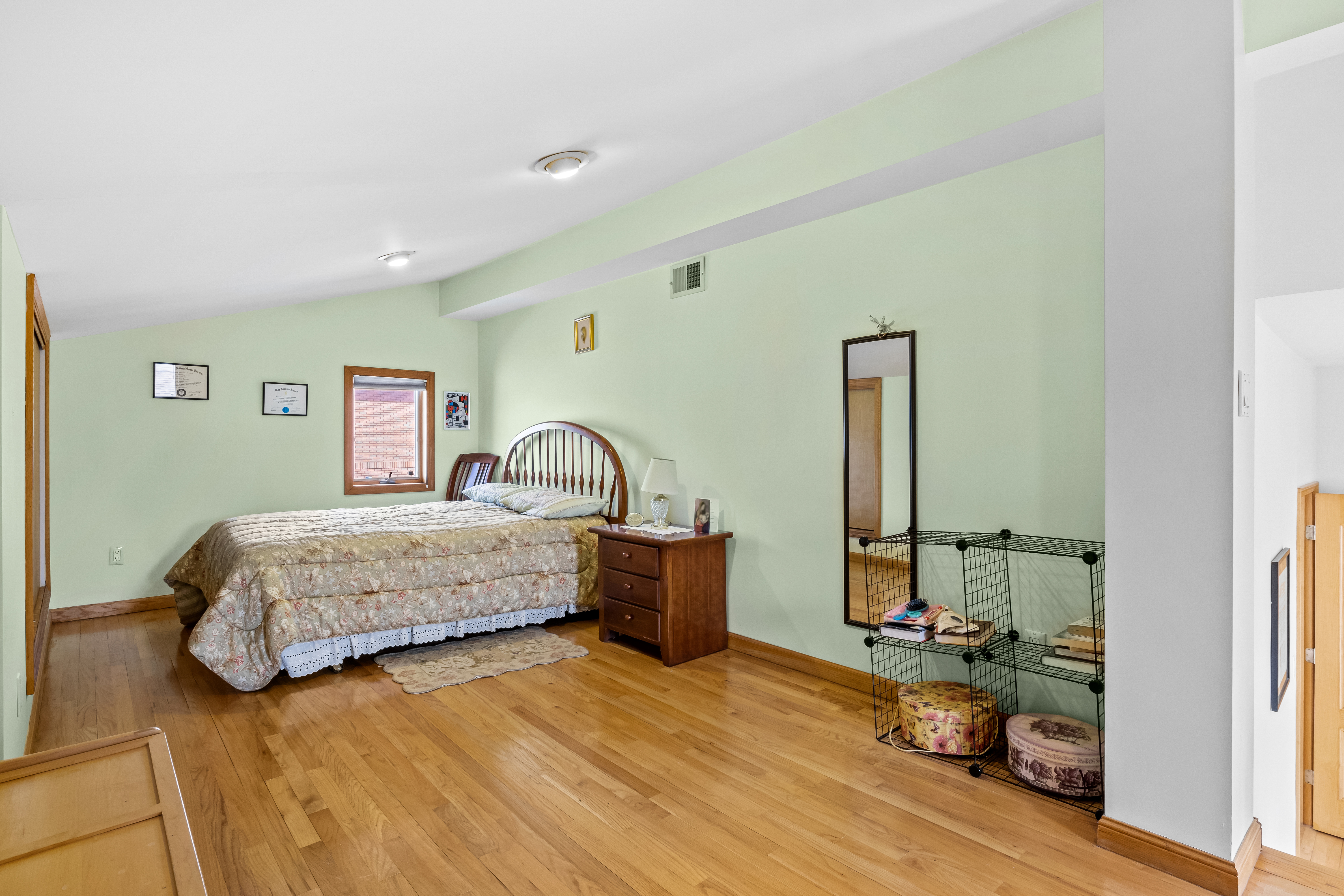 303 Whitman Drive Brooklyn, NY 11234 - Photo 22 of 37 a bedroom with a bed and a wooden floor