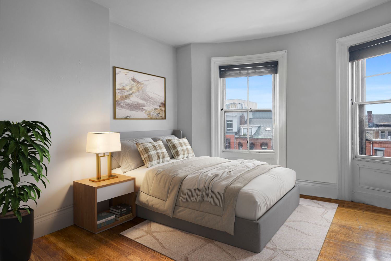 a bedroom with a bed lamp on desk and a window