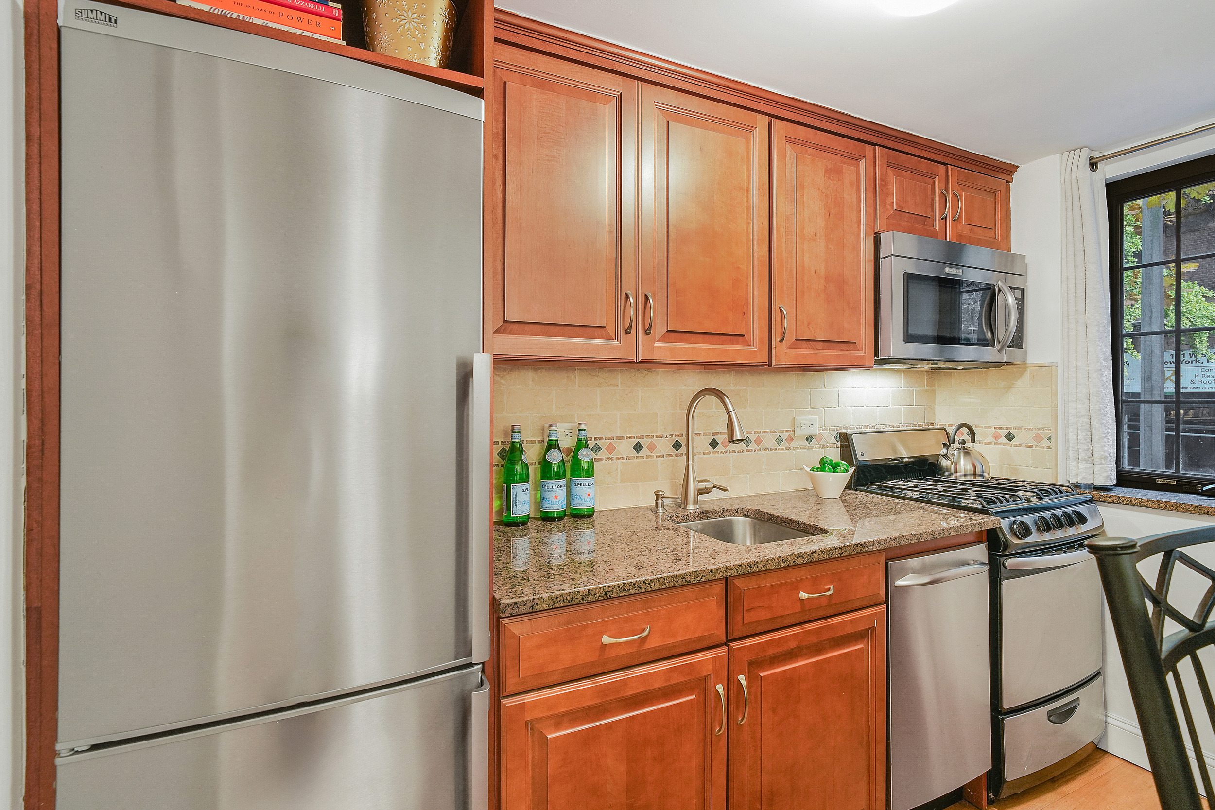 102 West 85th Street, Unit 2B Manhattan, NY 10024 - Photo 5 of 16 a kitchen with stainless steel appliances granite countertop a refrigerator and a sink
