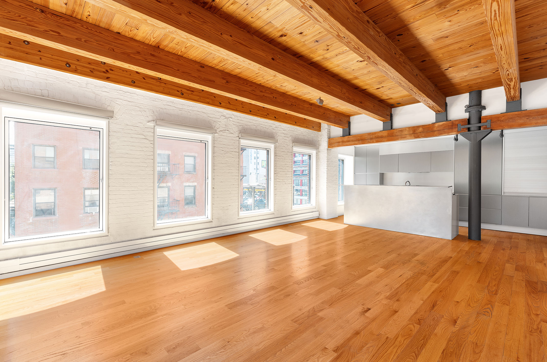 136 Baxter Street, Unit 3C Manhattan, NY 10013 - Photo 7 of 15 a view of an empty room with a window