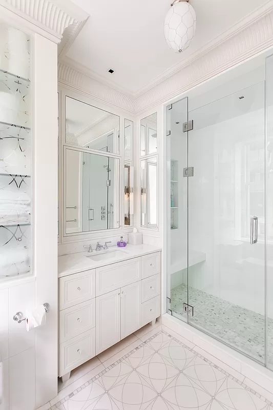 390 West End Avenue, Unit 7DS Manhattan, NY 10024 - Photo 19 of 31 a bathroom with a shower sink and mirror