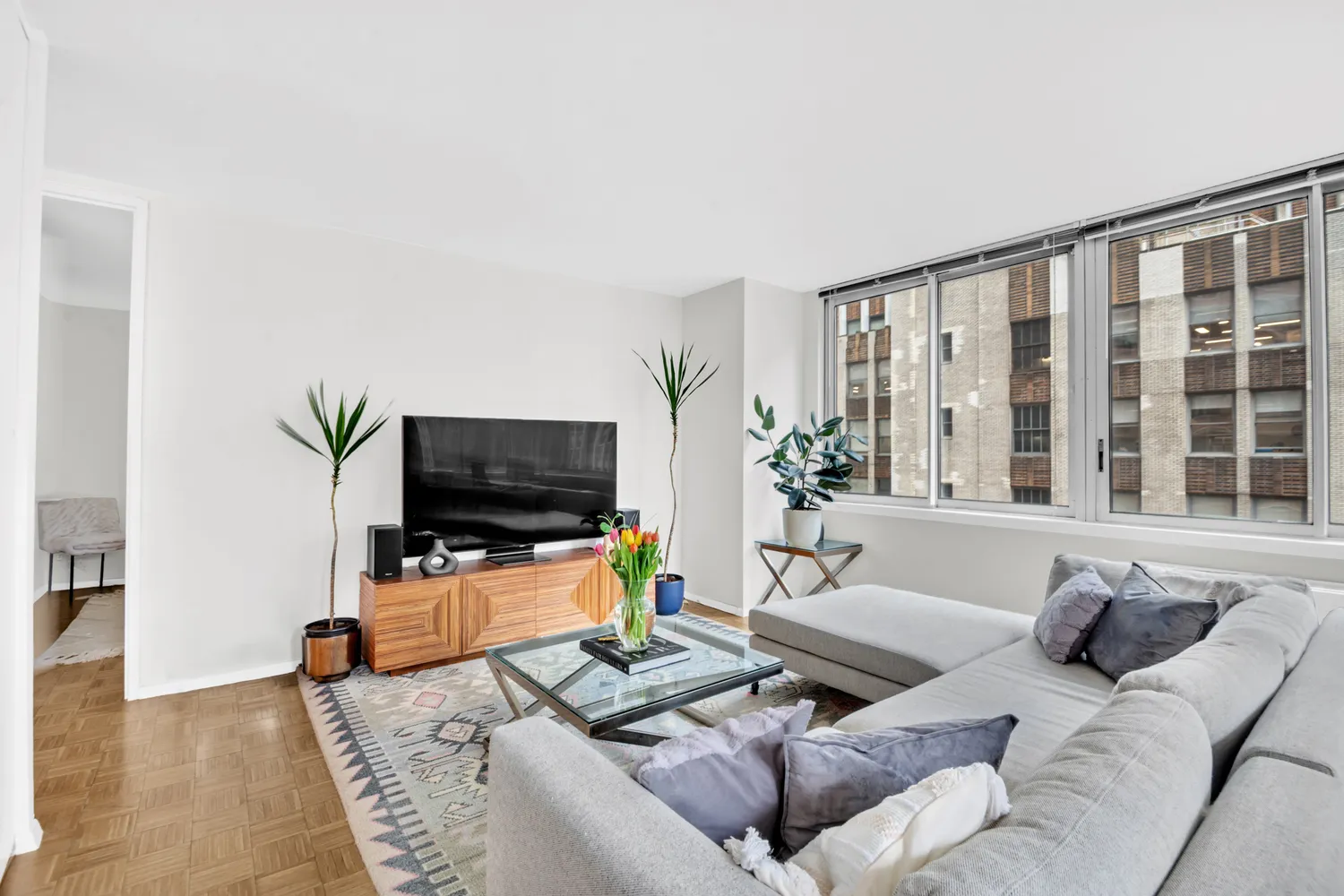 a living room with furniture and a flat screen tv