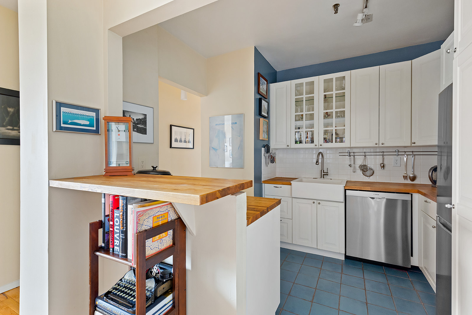 1 Tiffany Place, Unit 4B Brooklyn, NY 11231 - Photo 3 of 6 a view of a kitchen with stainless steel appliances granite countertop a sink and dishwasher a stove with wooden cabinets