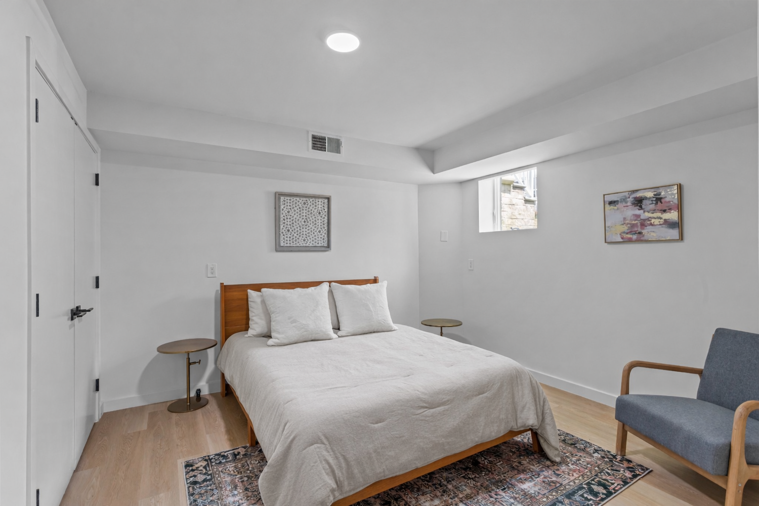 3112 Emmons Avenue, Unit 3124A2 Brooklyn, NY 11235 - Photo 10 of 17 a bedroom with a bed and a couch