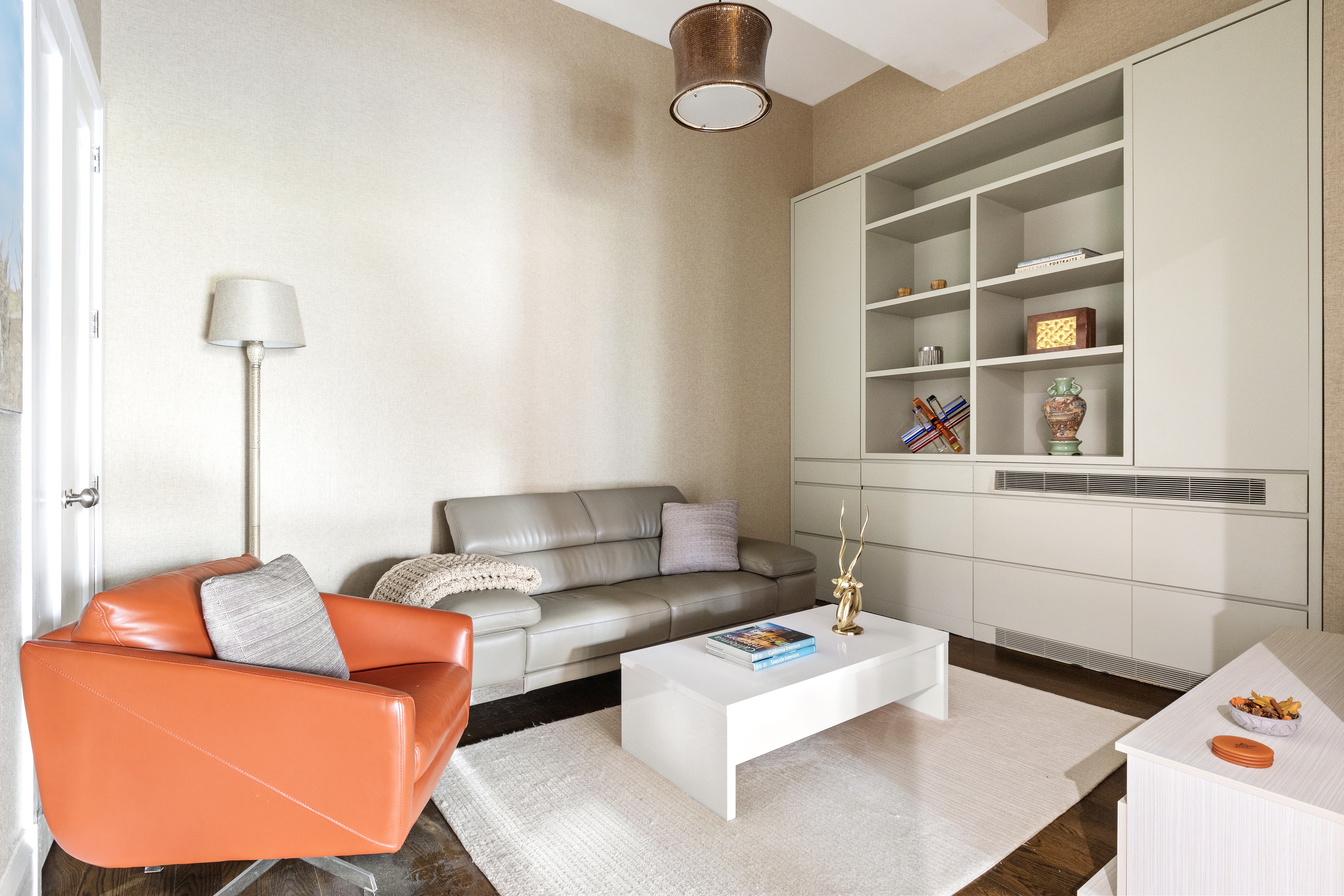 263 9th Avenue, Unit 5B Manhattan, NY 10001 - Photo 7 of 14 a living room with furniture and a window