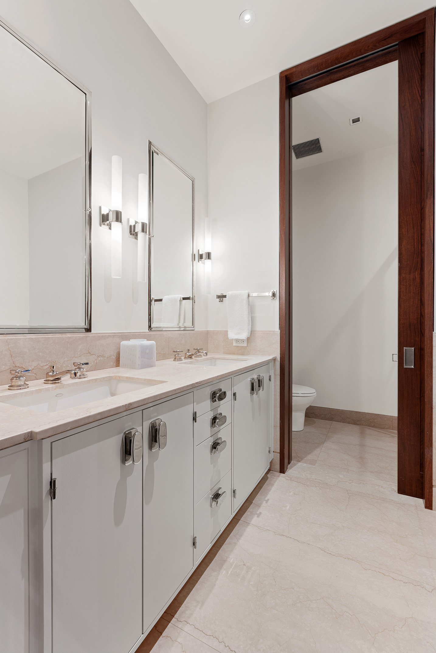 7 Hubert Street, Unit 8A Manhattan, NY 10013 - Photo 12 of 19 a bathroom with a double vanity sink and mirror