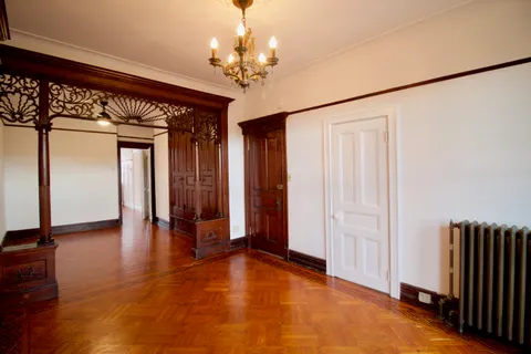 a view of livingroom with hardwood floor and hallway