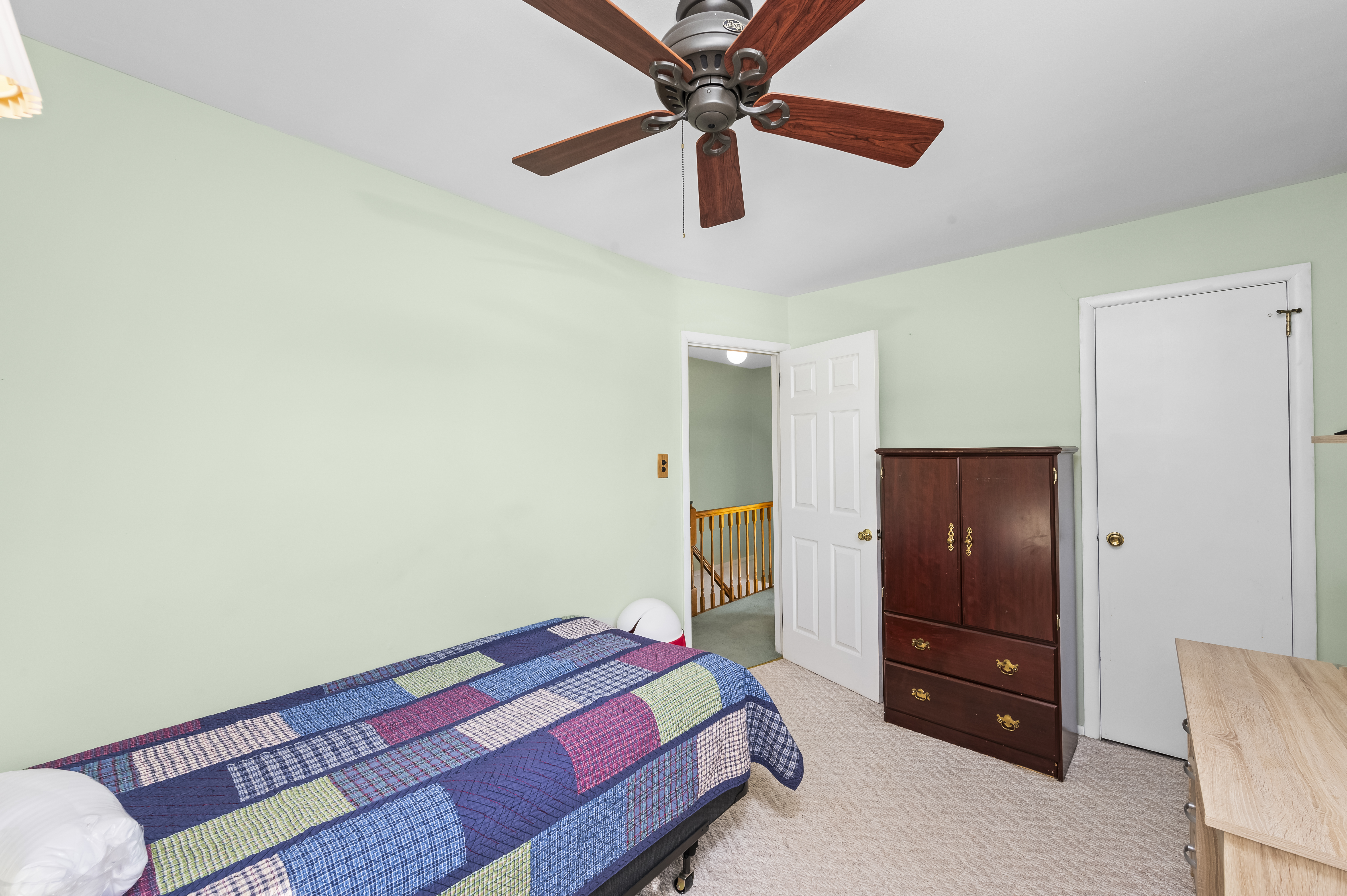 15 Area Place Staten Island, NY 10314 - Photo 16 of 27 a bedroom with a bed and a chandelier