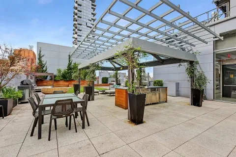 a view of a patio with a table and chairs