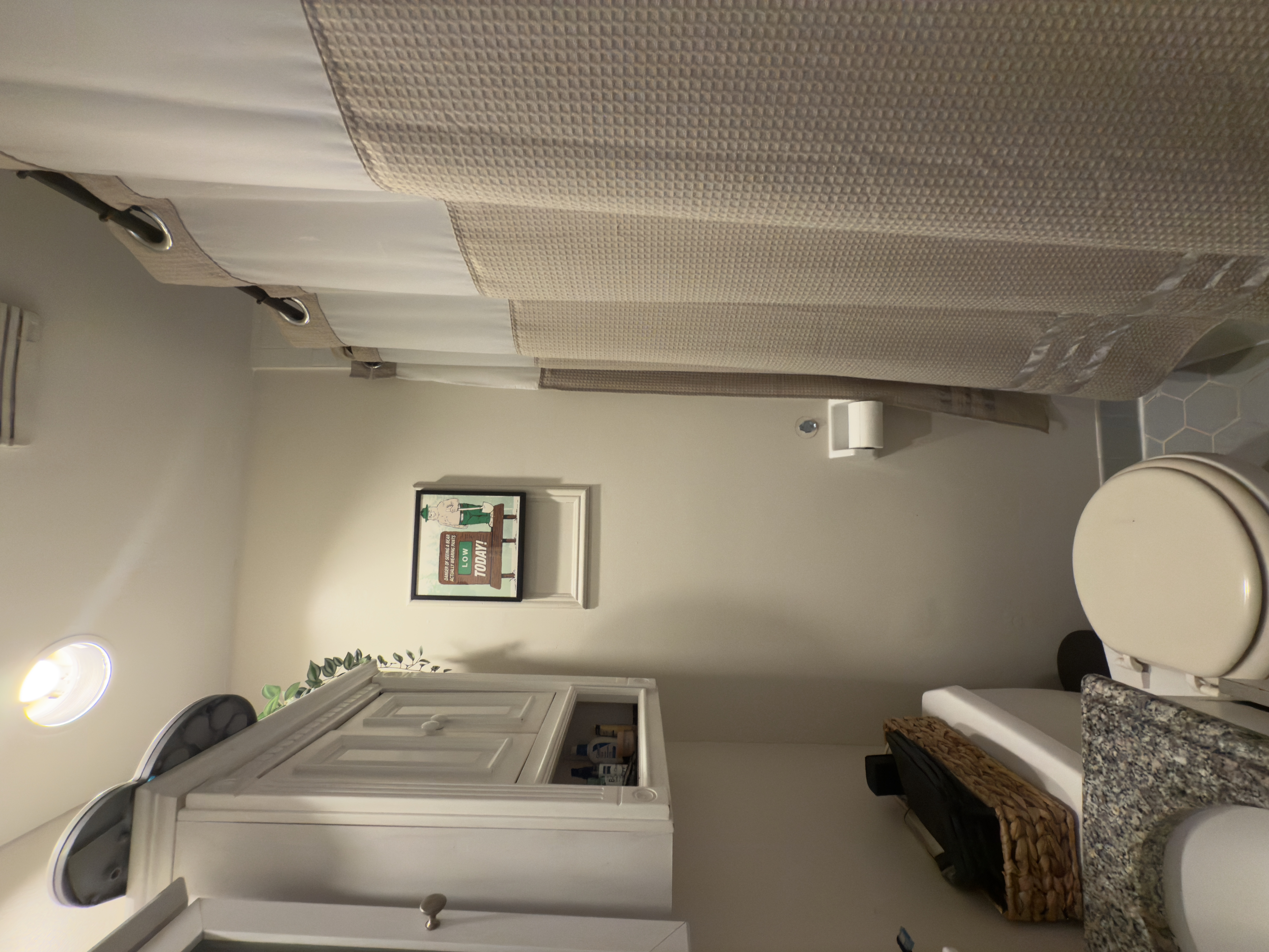 141 7th Avenue, Unit 1 Brooklyn, NY 11215 - Photo 15 of 16 a white toilet sitting next to a shower curtain