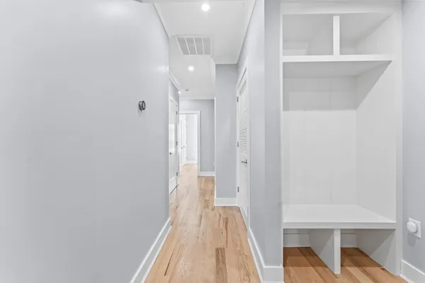 a view of a hallway with a white walls