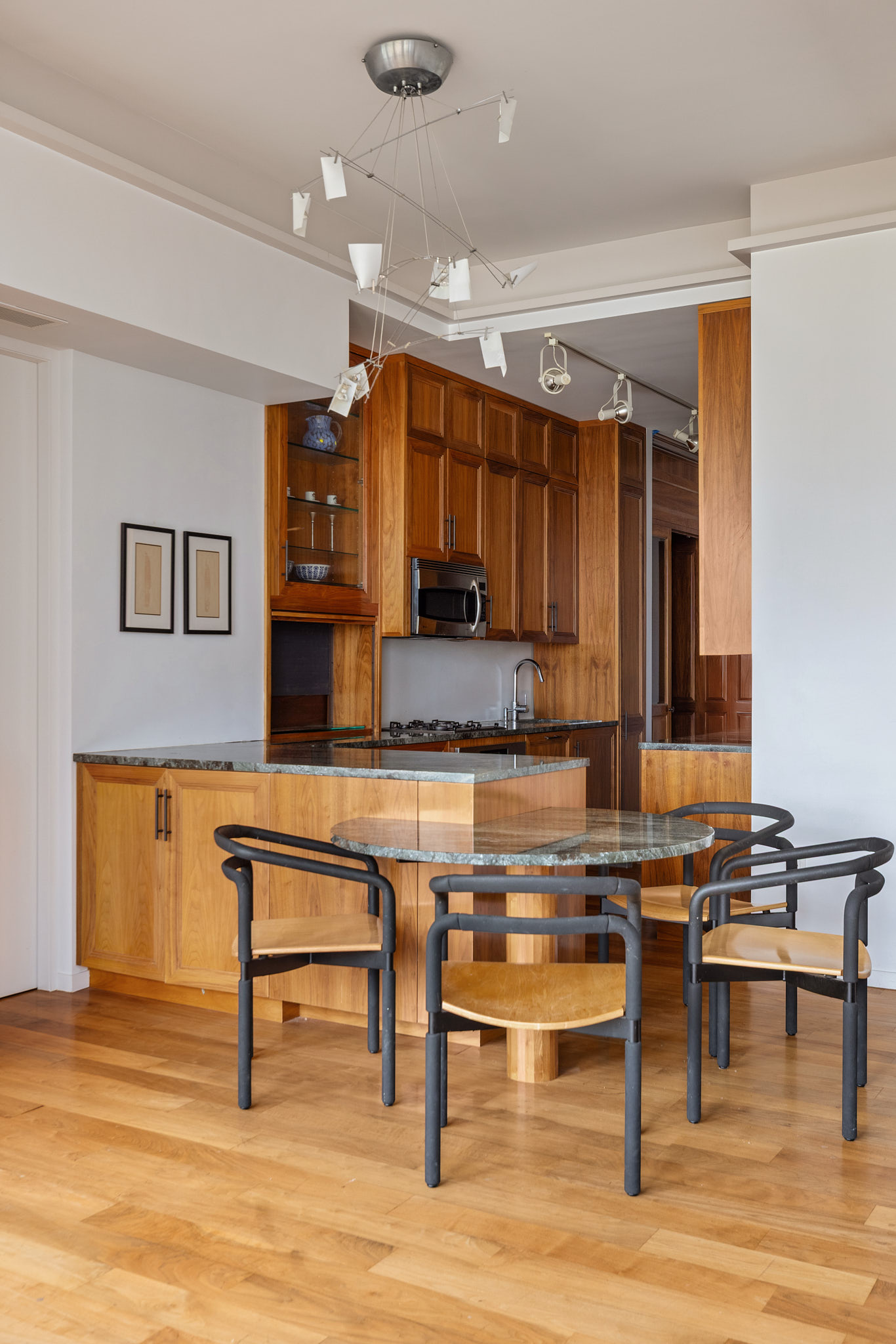 175 East Broadway, Unit 8A Manhattan, NY 10002 - Photo 4 of 11 a kitchen with stainless steel appliances granite countertop a stove and a sink