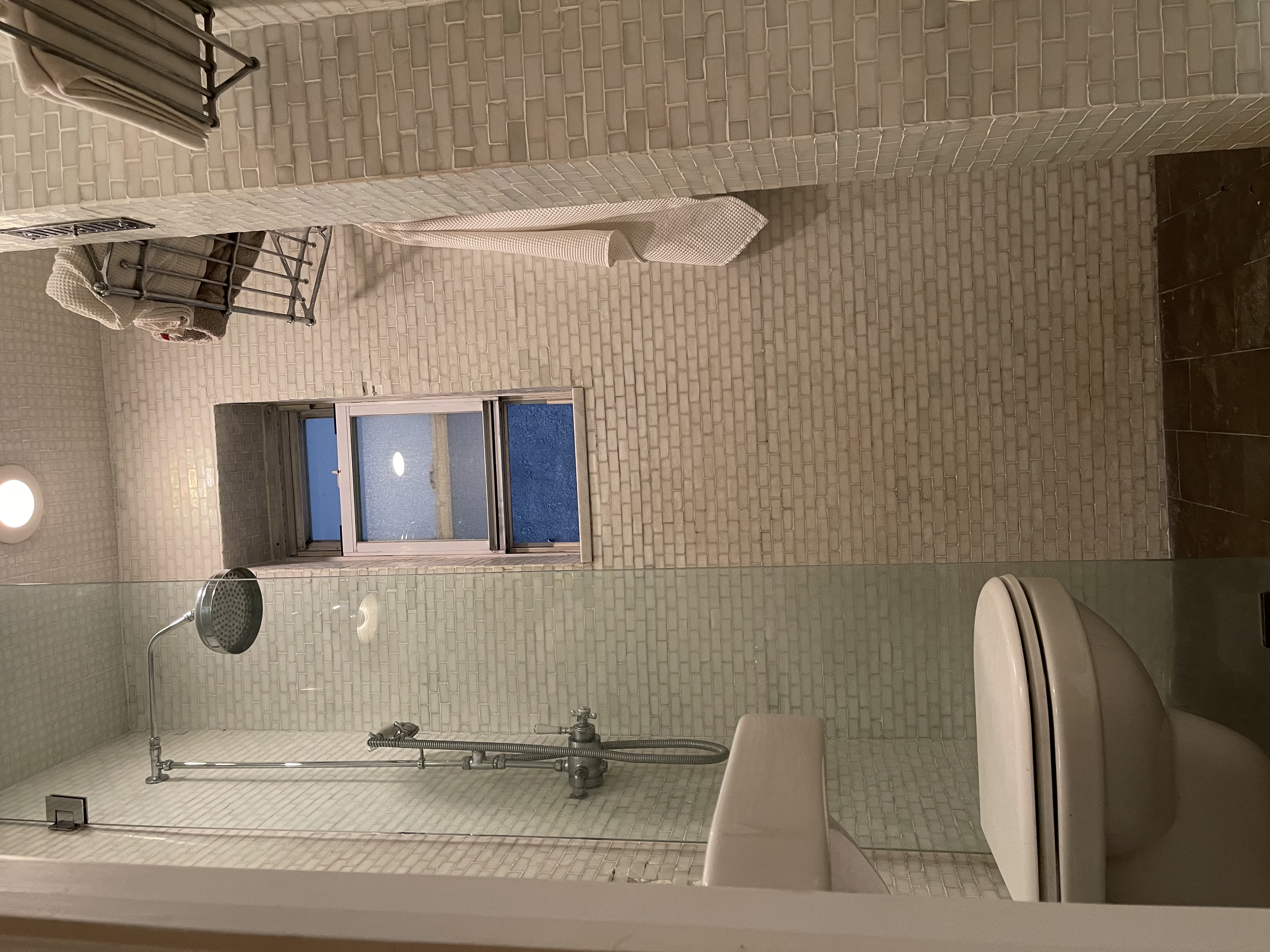 96 Perry Street, Unit B3 Manhattan, NY 10014 - Photo 9 of 16 a bathroom with a toilet and a shower