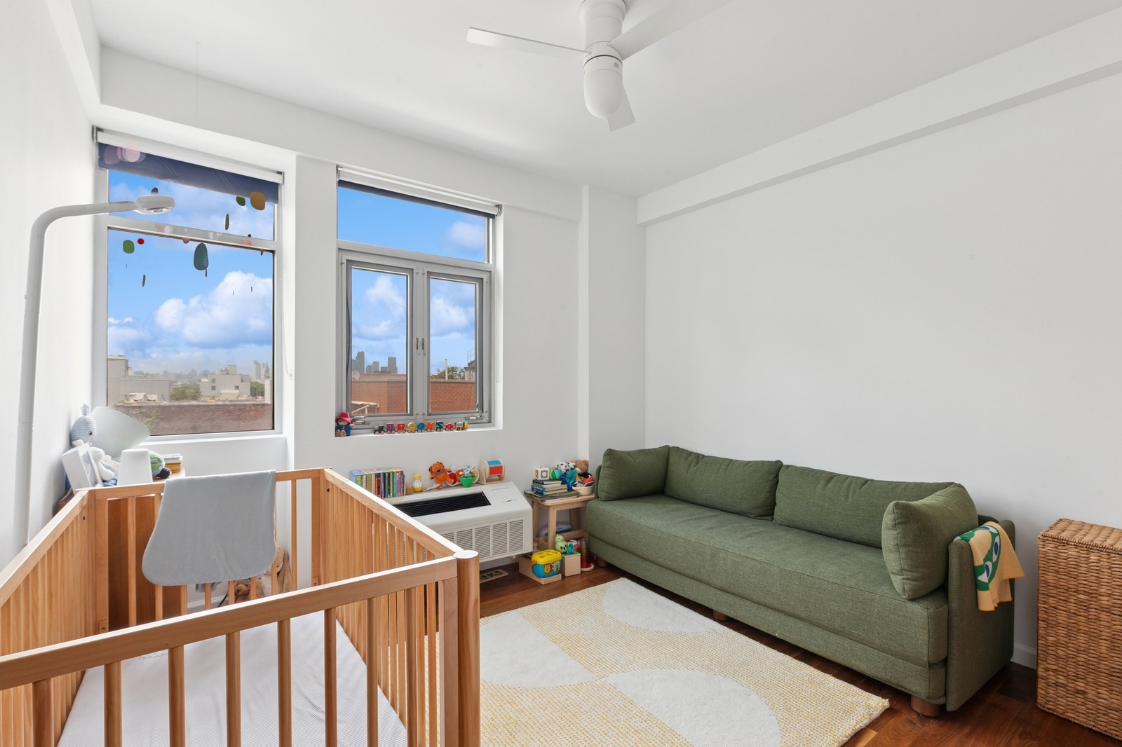 154 Skillman Avenue, Unit 5A Brooklyn, NY 11211 - Photo 6 of 11 a living room with furniture and a window