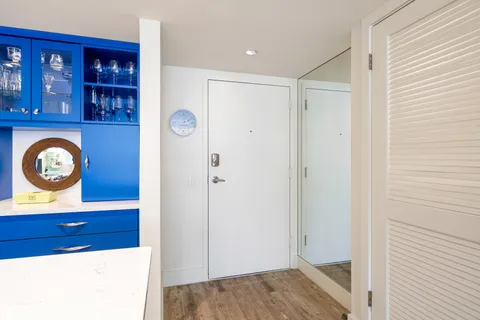 a view of entryway with wooden floor