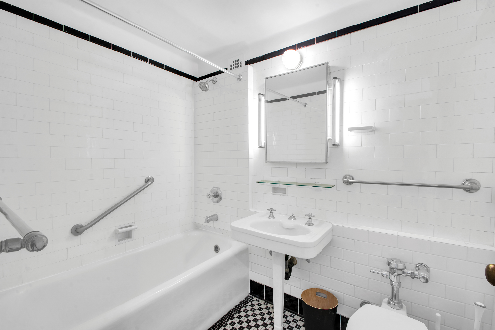 410 West 24th Street, Unit 9K Manhattan, NY 10011 - Photo 9 of 14 a bathroom with a sink and a bathtub