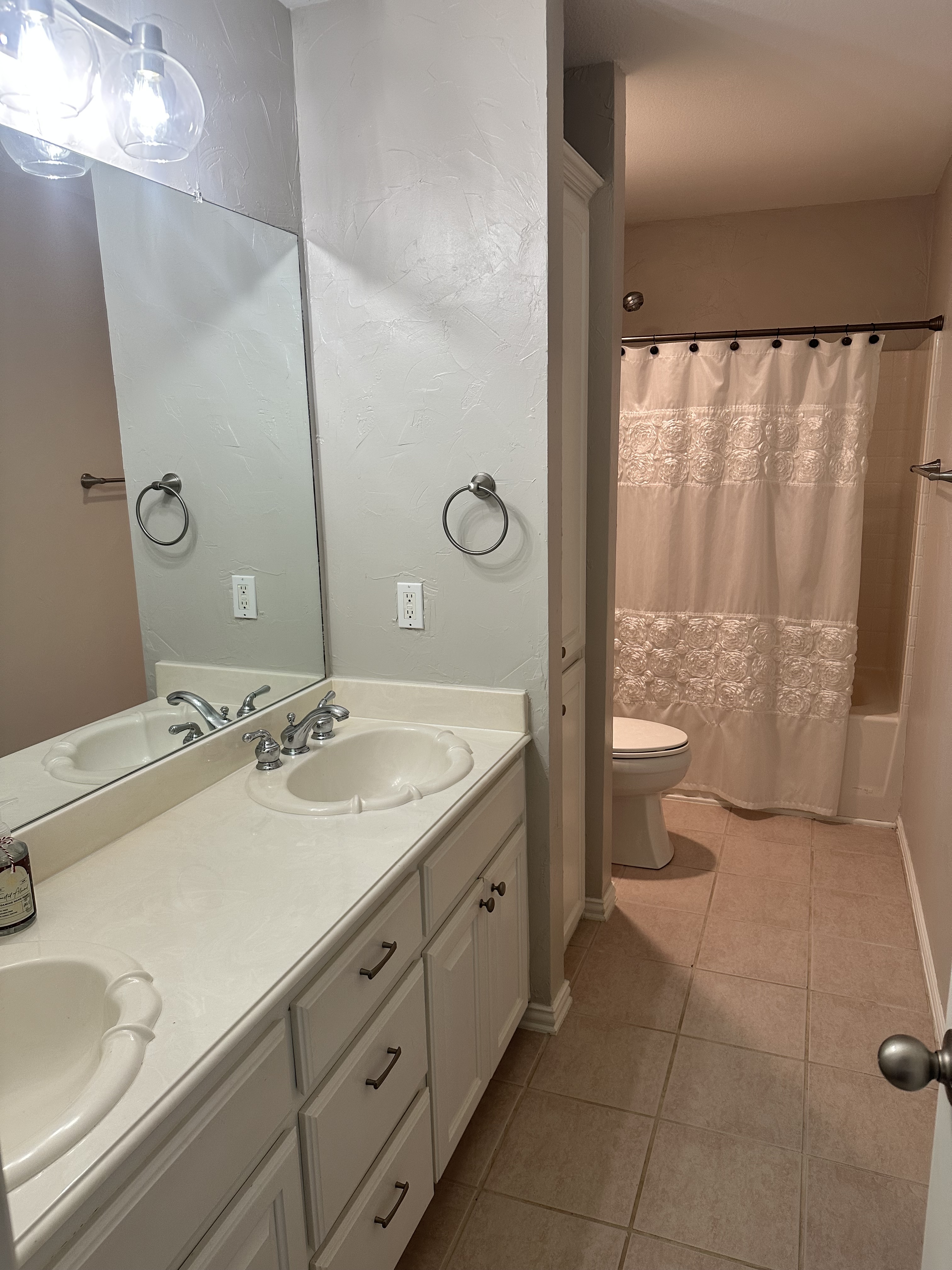 3588 Heritage Trail Celina, TX 75009 - Photo 19 of 19 a bathroom with a granite countertop sink a toilet and a large mirror