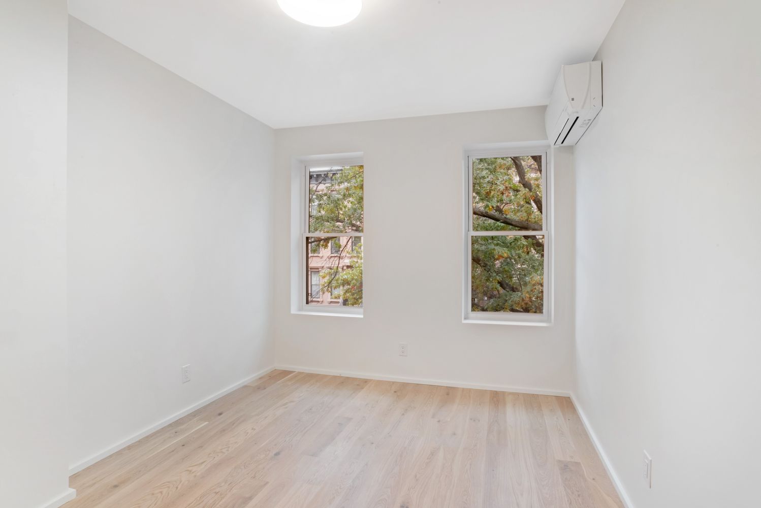 42 Monroe Street Brooklyn, NY 11238 - Photo 11 of 21 an empty room with a window