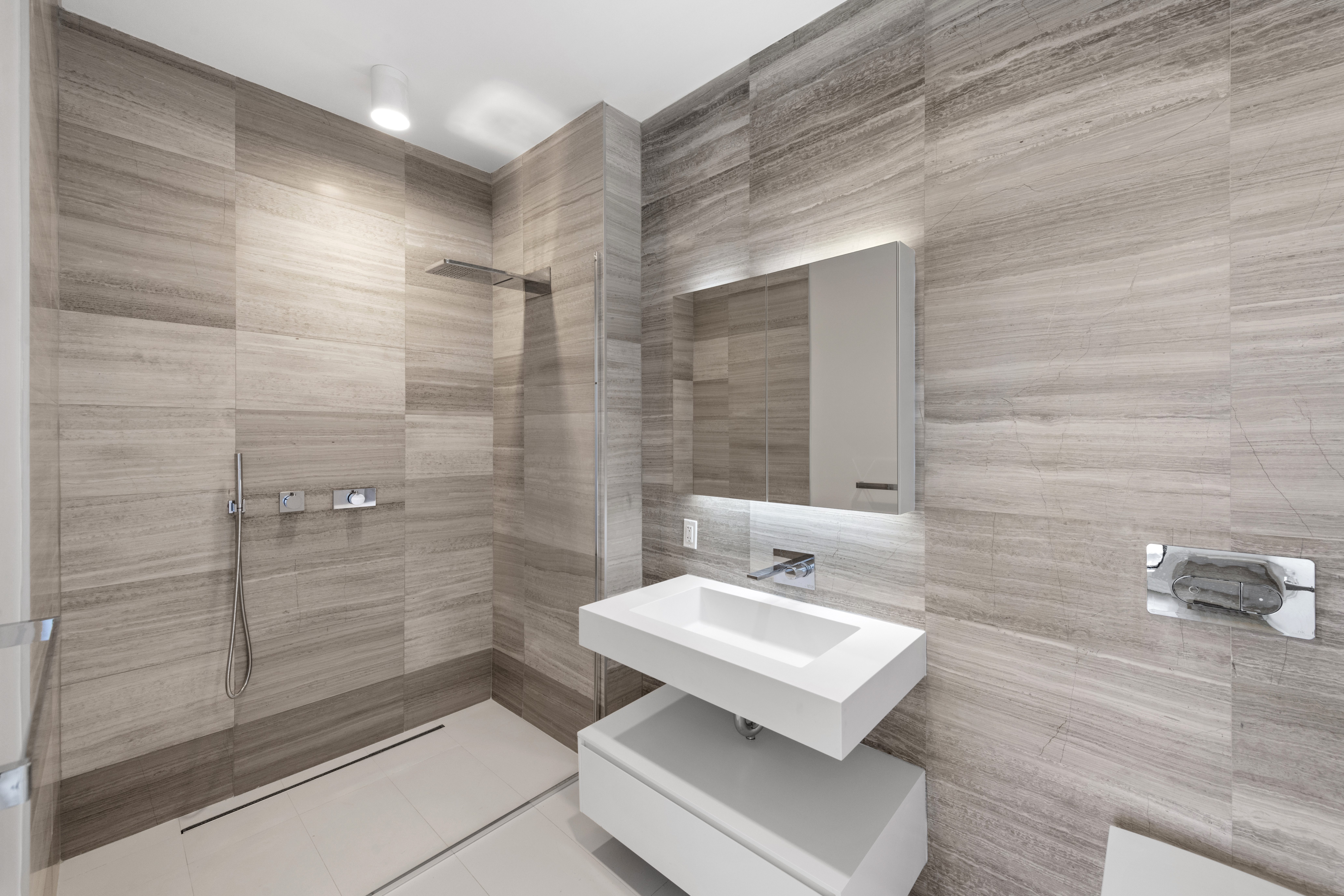 160 Imlay Street, Unit 3B3 Brooklyn, NY 11231 - Photo 9 of 14 a bathroom with a sink a toilet and shower