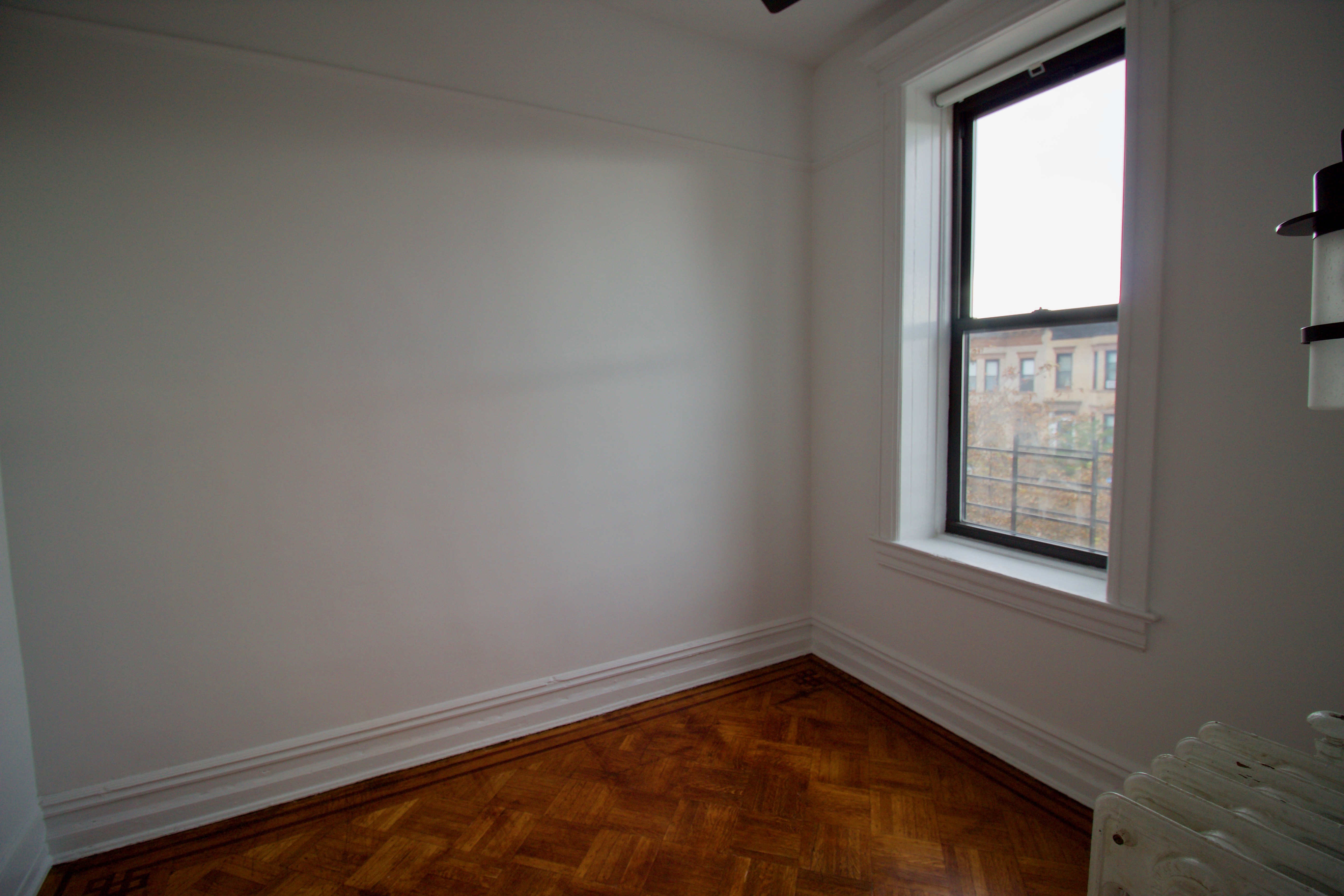403 Caton Avenue, Unit 3 Brooklyn, NY 11218 - Photo 22 of 31 an empty room with a window