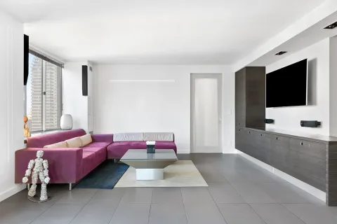 a bedroom with furniture and a flat screen tv