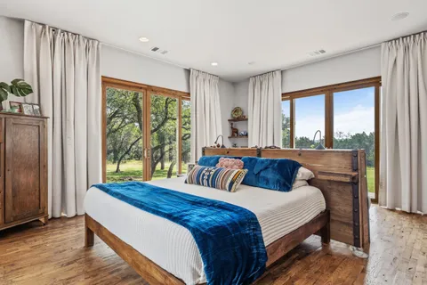 a bedroom with furniture and a book shelf