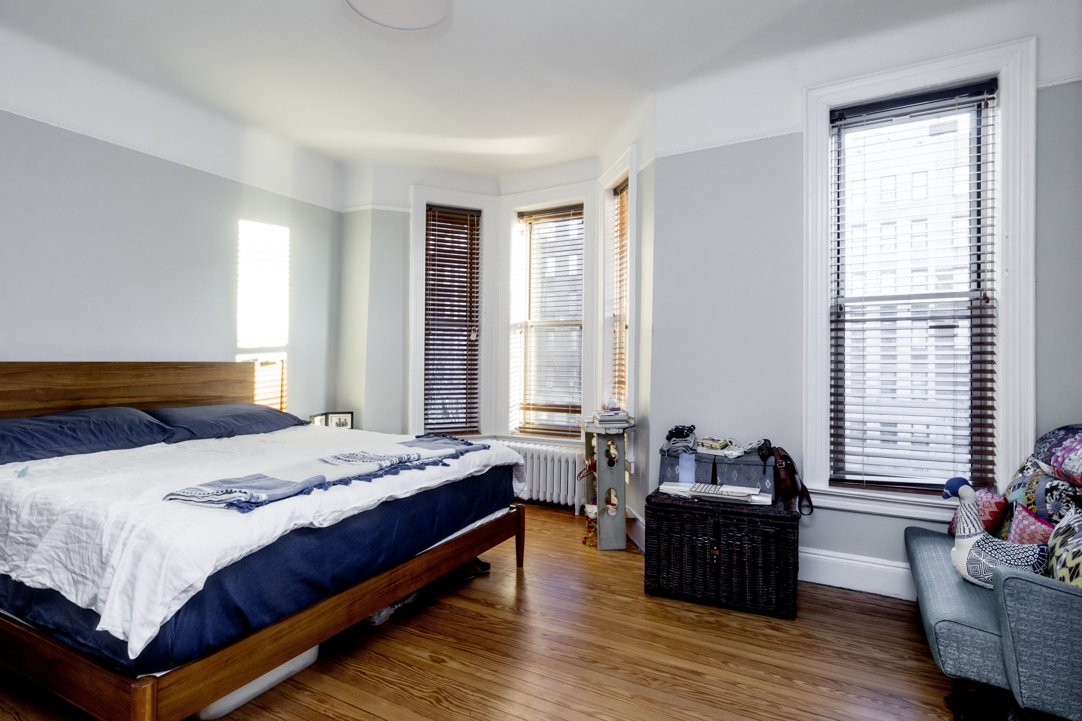 285 Empire Boulevard Brooklyn, NY 11225 - Photo 8 of 18 a bedroom with a bed and wooden floor