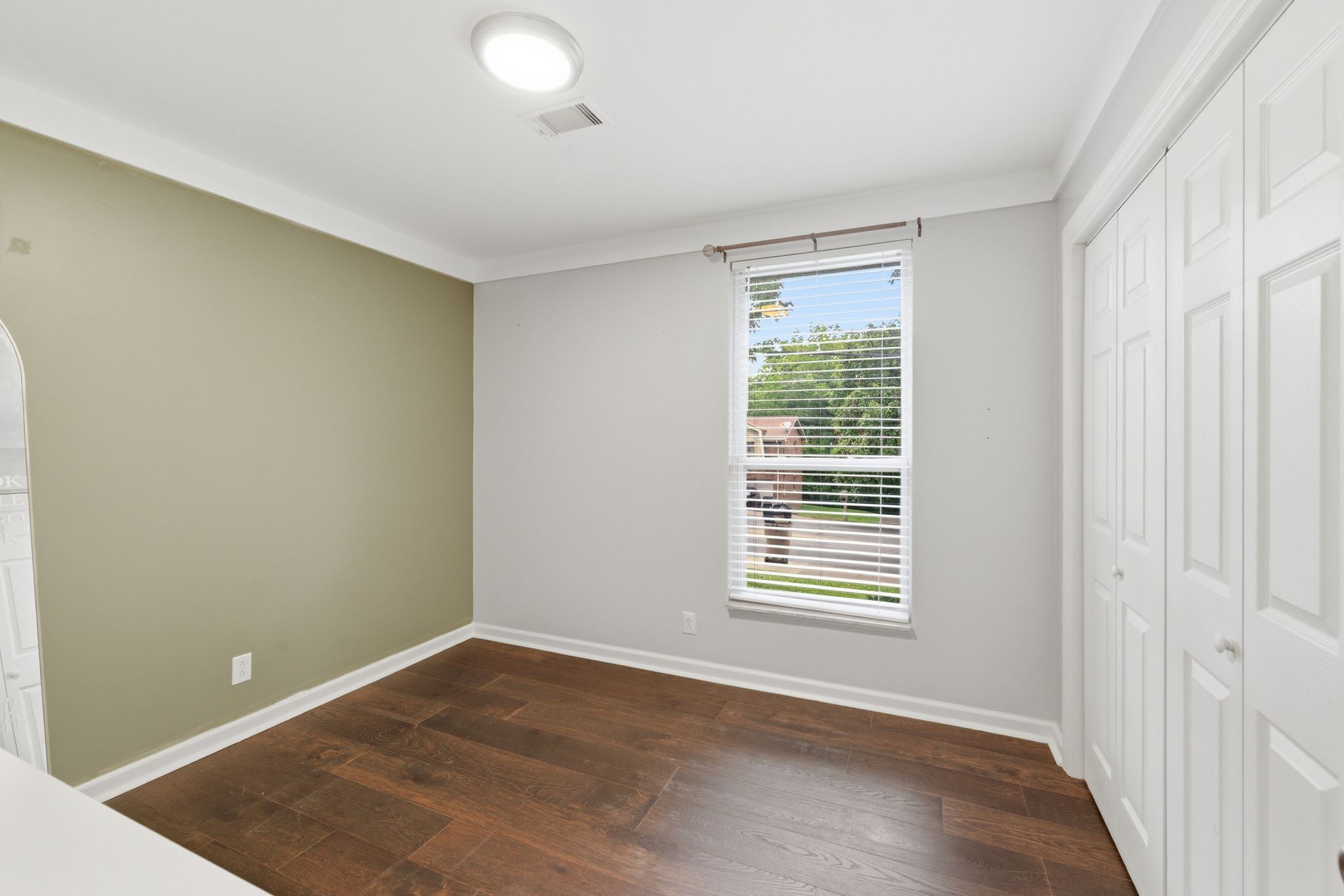 307 Paragon Mills Road Nashville, TN 37211 - Photo 19 of 29 an empty room with wooden floor and windows