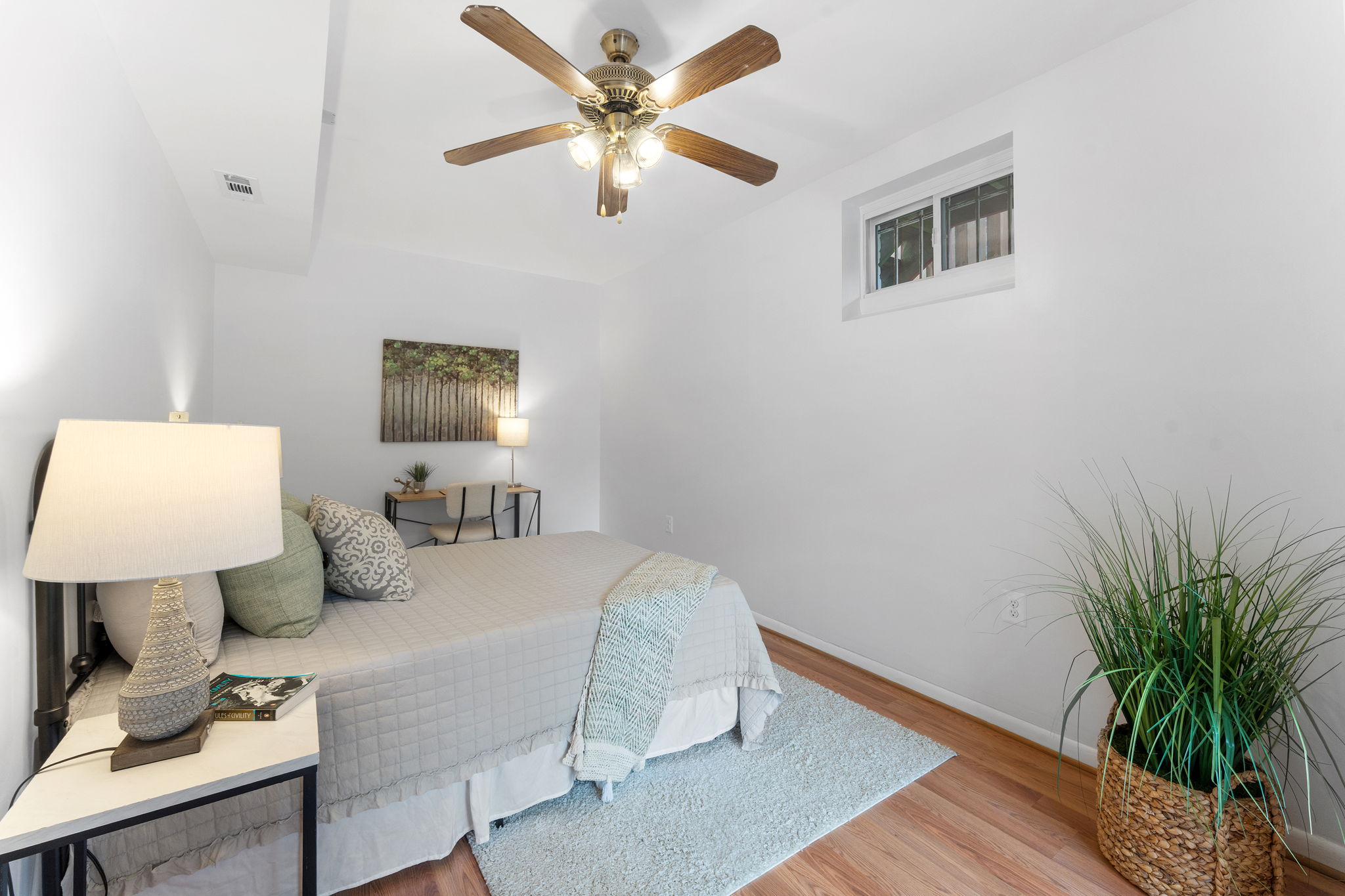 1325 Locust Road Northwest Washington, DC 20012 - Photo 43 of 56 a bedroom with a bed and a potted plant