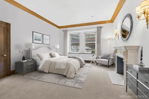 a bed room with a bed and a chair