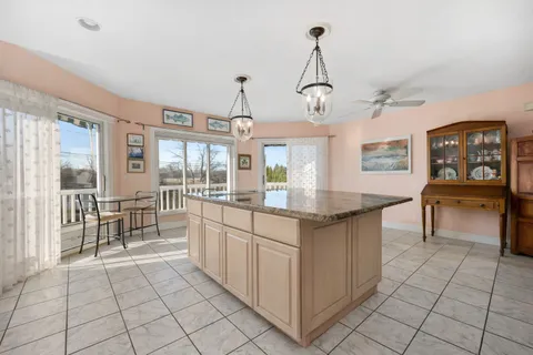 a kitchen with a sink cabinets and window