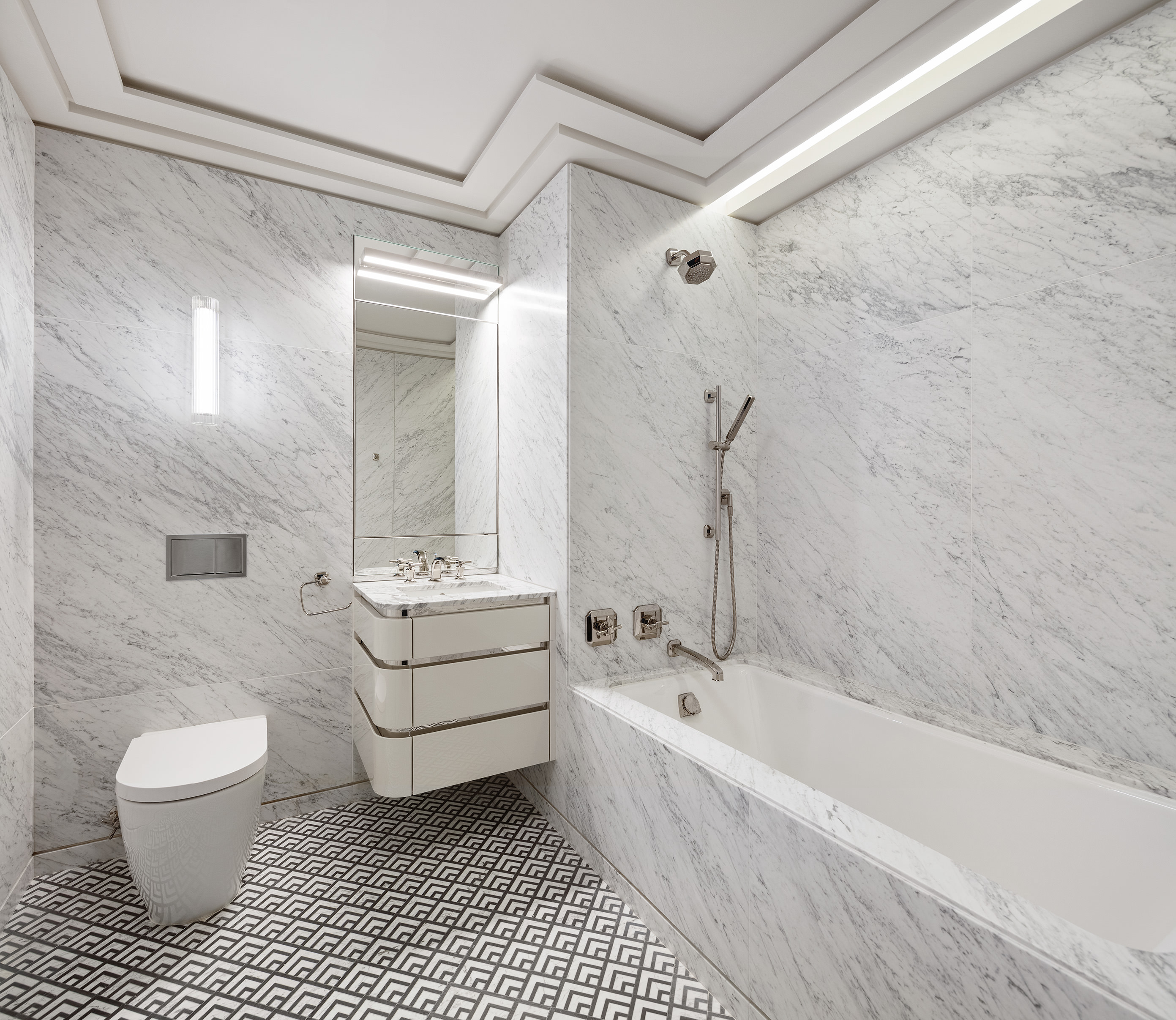 303 Park Avenue, Unit 2103 Manhattan, NY 10022 - Photo 4 of 22 a bathroom with a sink a toilet and bathtub