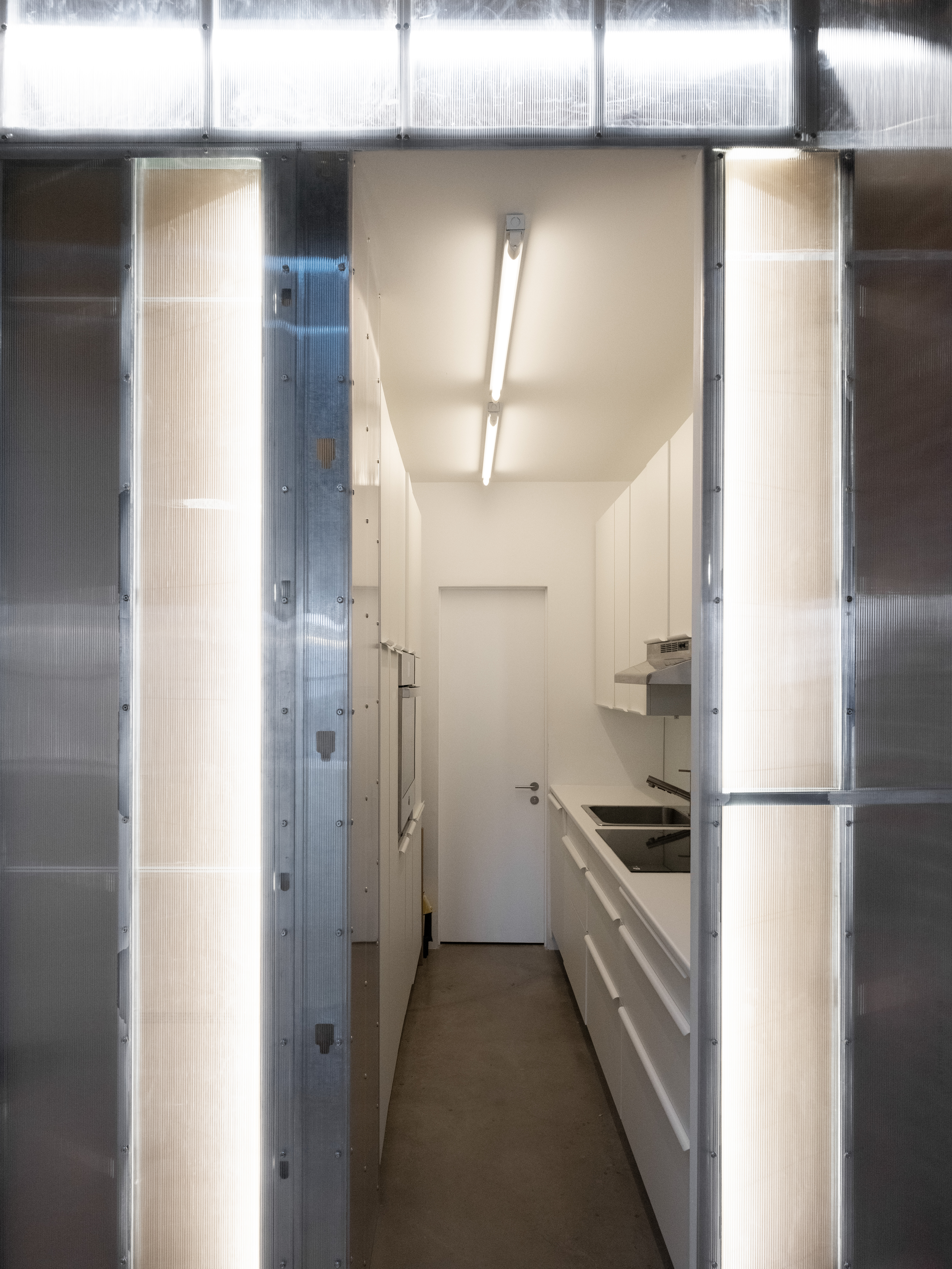 186 East 2nd Street, Unit 16 Manhattan, NY 10009 - Photo 13 of 17 a kitchen with a refrigerator and a sink