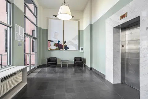 a view of a kitchen with a dining table and chairs